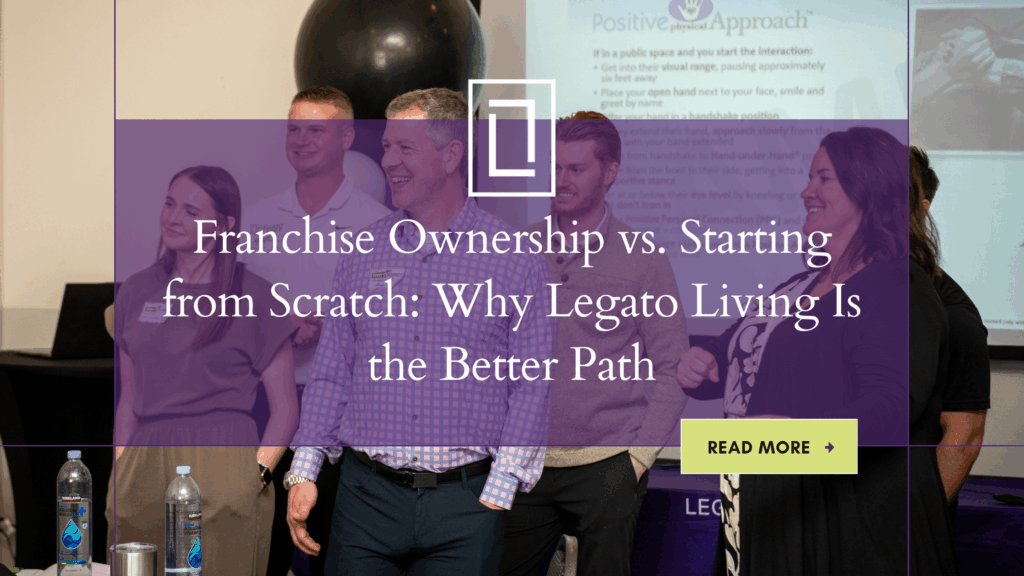 Franchise Business Owners have a happy exchange during a senior care franchise meeting